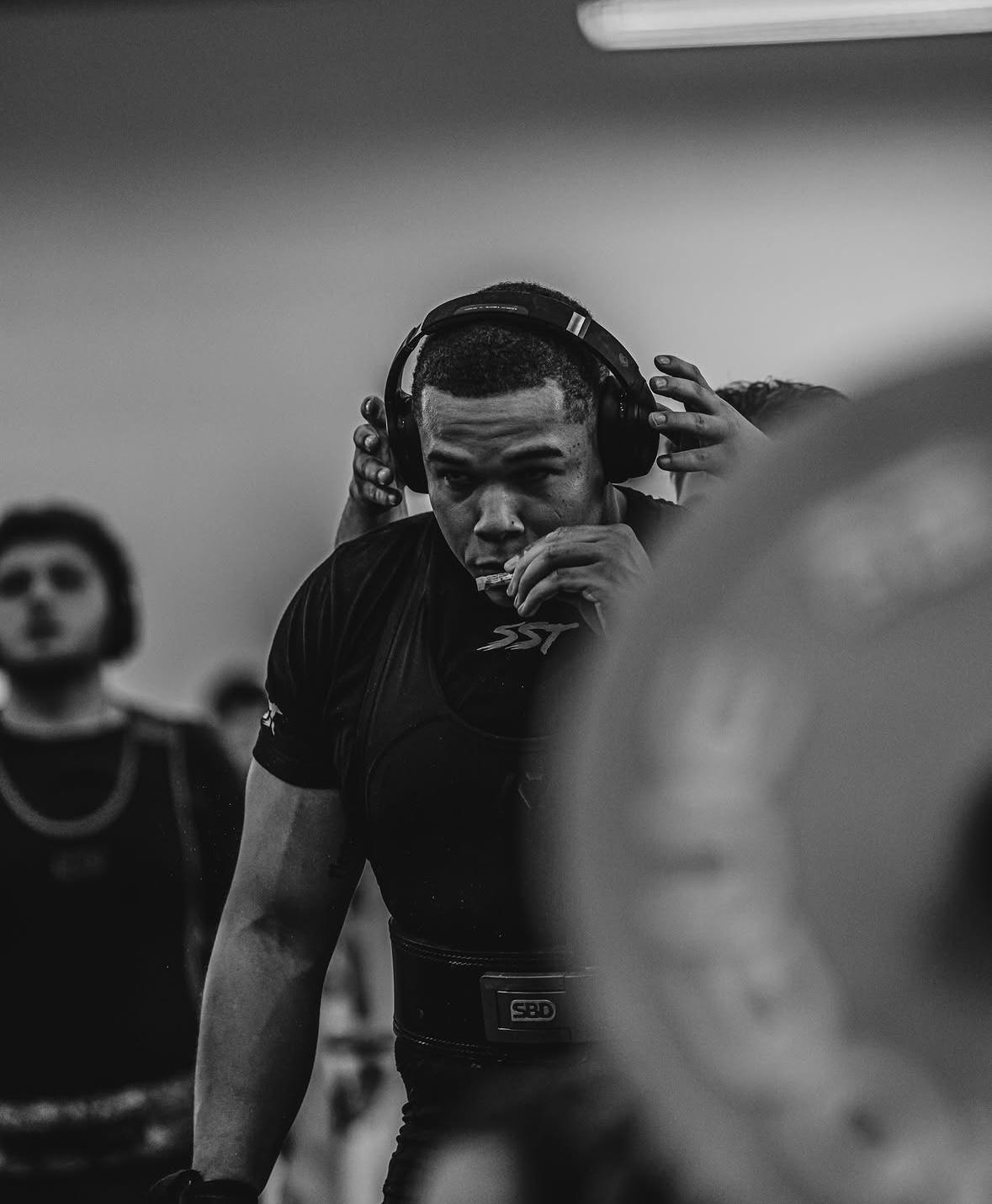 Gavin Carson in training gear, focused and ready to lift
